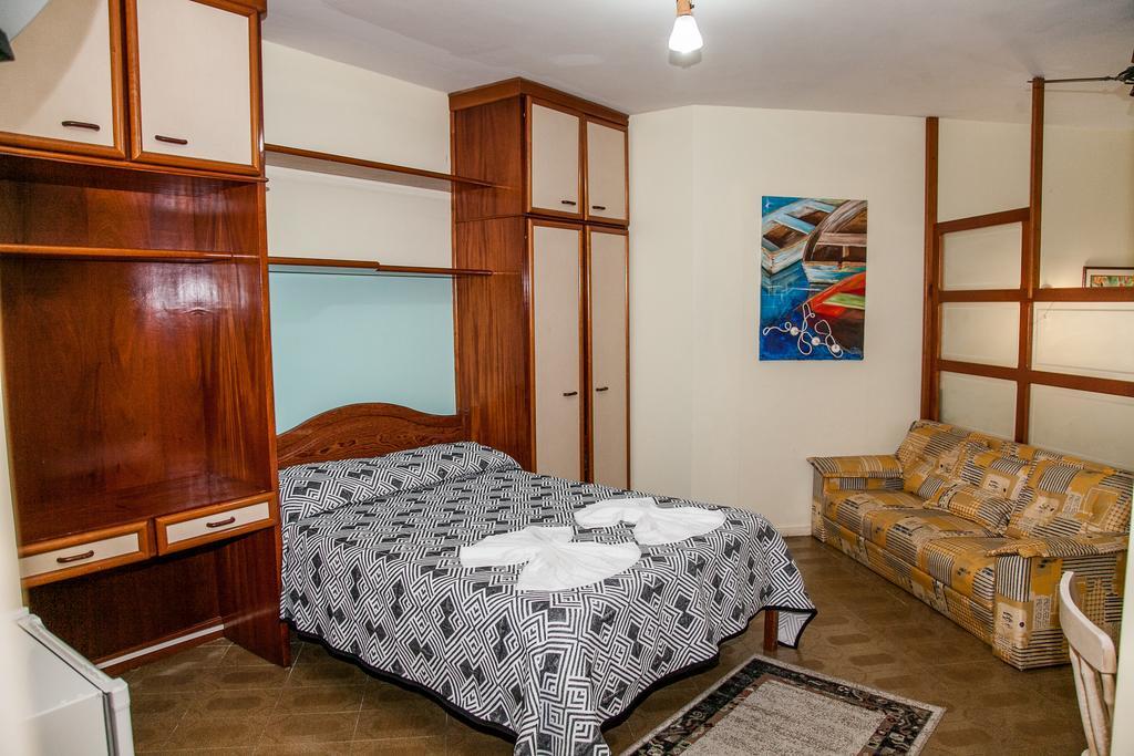 Отель Residencial Ilha Dourada Говернадор-Селсу-Рамус Номер фото